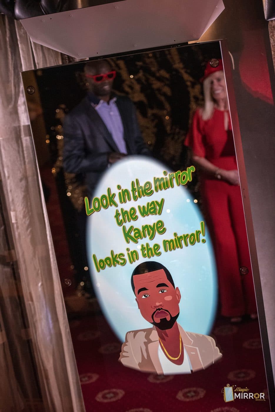 Couple taking a photo at the mirror booth during a tri-state area wedding